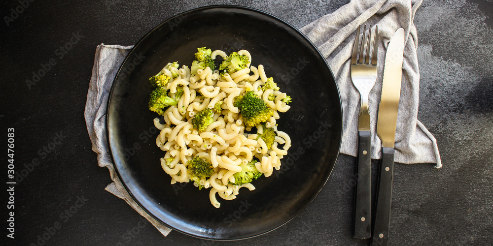 pasta broccoli, vegetarian dish (main course with vegetables Cavatappi, Elbow) menu concept. food background. top view. copy space pasta broccoli, vegetarian dish (main course with vegetables Cavatappi, Elbow) menu concept. food background. top view. copy space