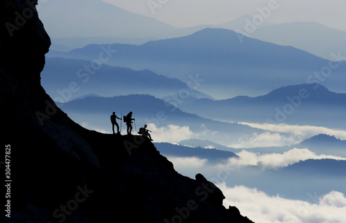 daily climbing and excitement of successful climbers in summit mountains © emerald_media