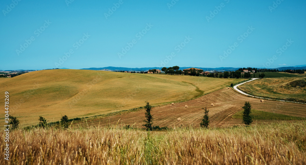 Beautiful landscape in Tuscany, Italy. Vintage tone filter effect with noise and grain.