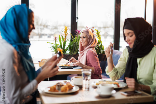 Photography Young muslim woman in the restaurant