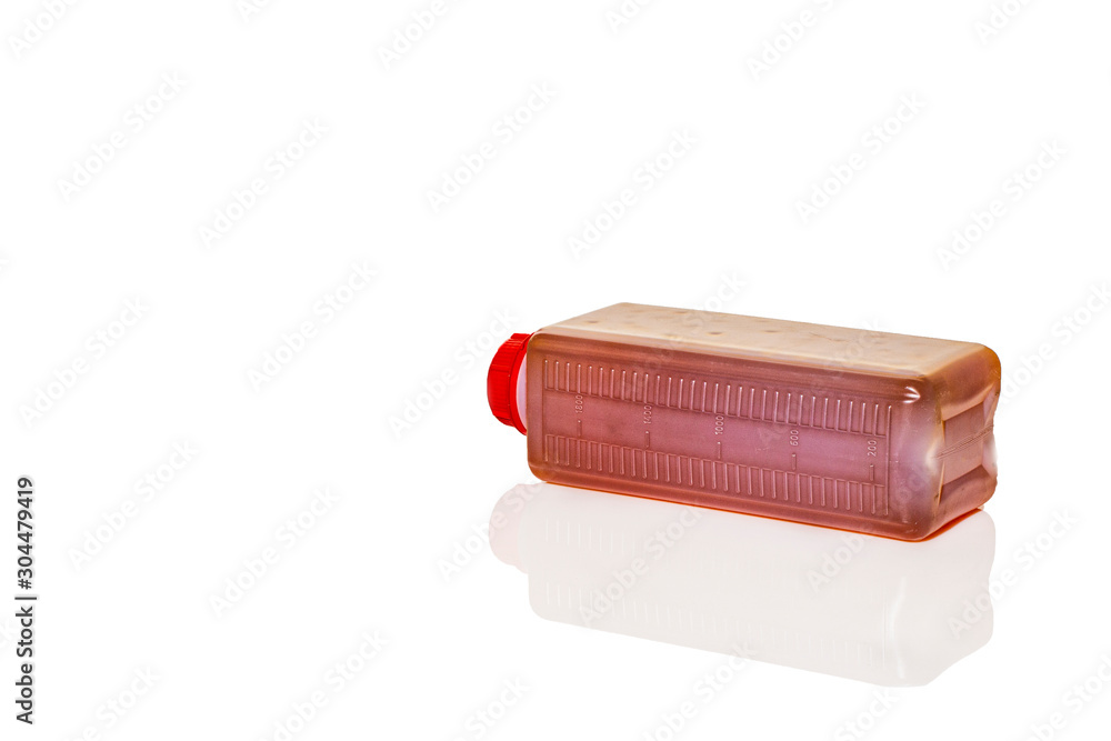 Bottle with industrial oil on a white background. Bottle with industrial oil on a white background.
