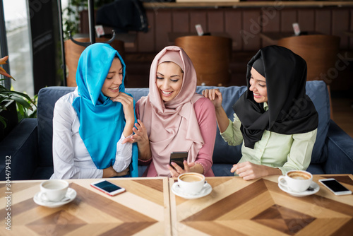 Photography Young muslim woman in the restaurant