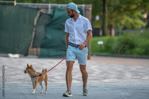 Owner walk with dog in park