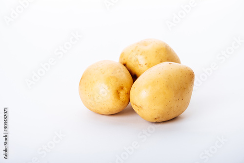 organic raw potatoes on white background