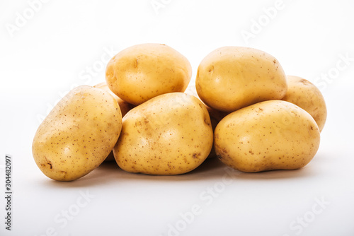 organic raw potatoes on white background