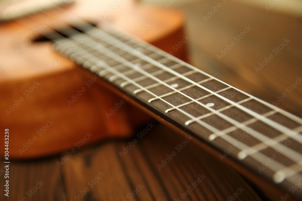 Fototapeta premium Ukulele on wooden background