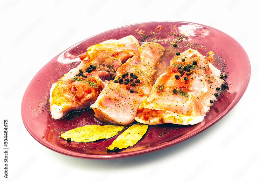pork steaks on ceramic dishware pork steaks on ceramic dishware