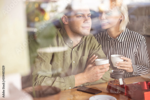 Handsome man being happy spending morning with his girlfriend