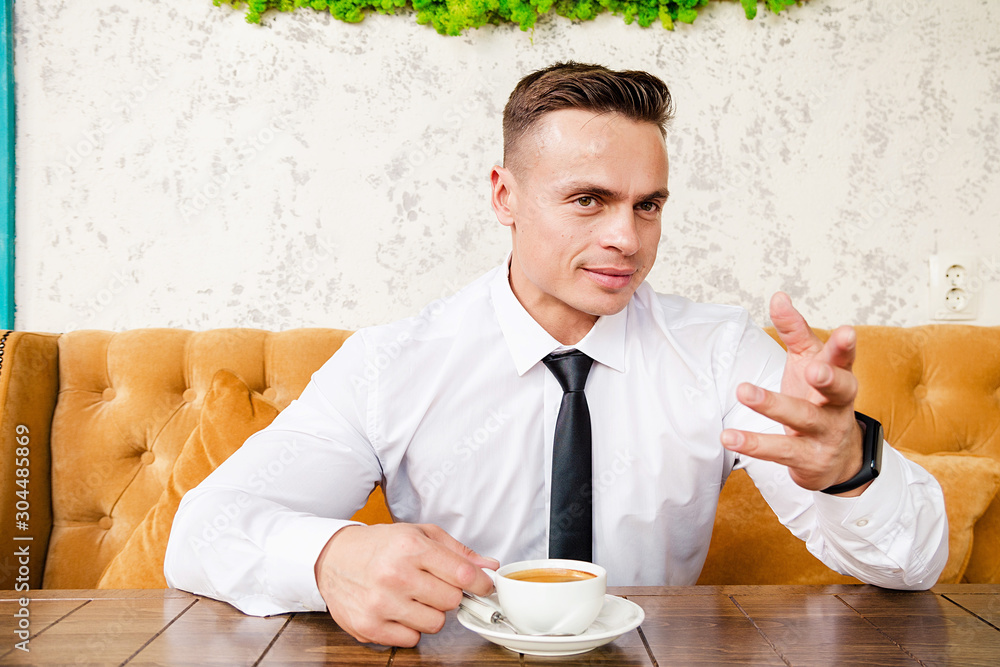 Businessman drinking a cup of coffee Businessman drinking a cup of coffee