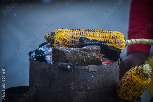 the corn is roasted on the oven in mall road nainital uttarakhand, Indian Food  photo