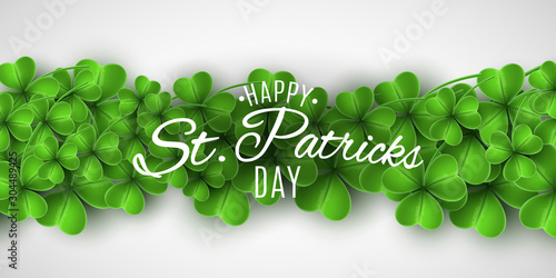 Saint Patricks Day banner. Green clovers and stylish lettering on a white background. Holiday cover. Vector illustration