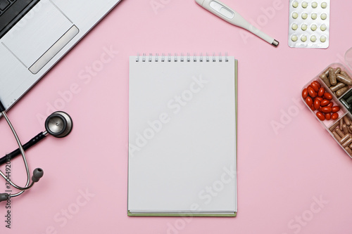 Wallpaper Mural Doctor pink desk table with stethoscope, medicine, notebook. Top view with copy space, flat lay. Torontodigital.ca