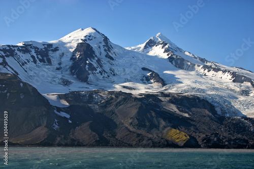 Beerenberg volcano on a foggy morning on Jan Mayen volcanic island.