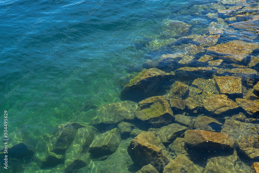 Many rocks are stacked on the edge of the lake. Many rocks are stacked on the edge of the lake.