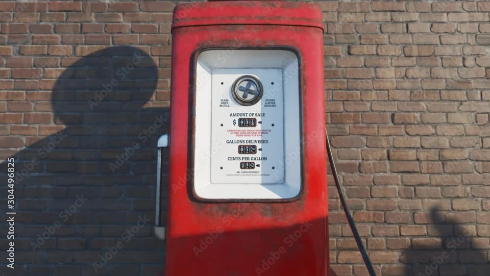 Retro gas pump. The old, rusted, red device is working and pumping gasoline. Retro gas pump. The old, rusted, red device is working and pumping gasoline.