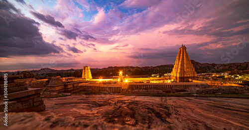 sunset over the temple in old city hampi photo