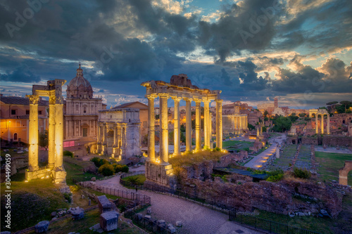 Forum Romanum archeological site in Rome with dramatic colorufl sky