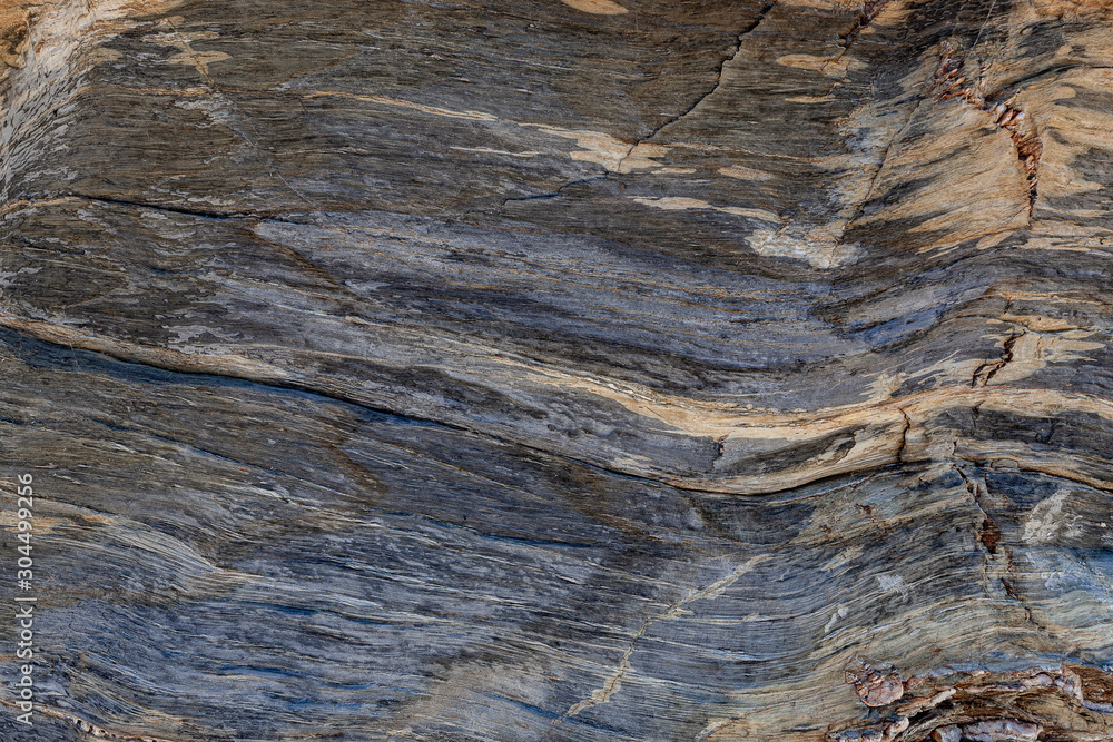 Naklejka premium Textura natural da superfície da rocha, onde se pode ver as linhas desenhadas no longo do tempo. Pode ser usado como o fundo.
