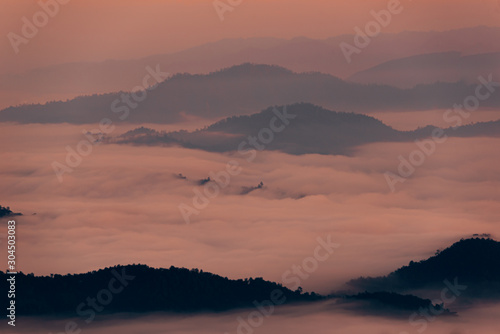 Fototapeta Naklejka Na Ścianę i Meble -  Mountain Mist in sunrise,mist on sunrise,mist over mountain during sunrise.Beautiful landscape in the mountains at sunrise.