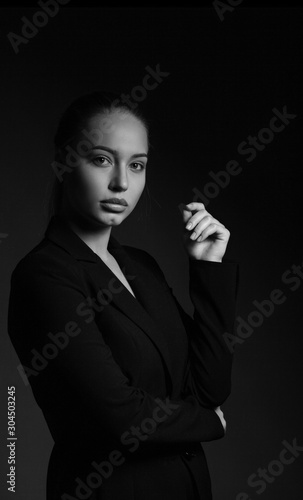 Fototapeta Naklejka Na Ścianę i Meble -  Contrast black and white portrait of a beautiful girl.