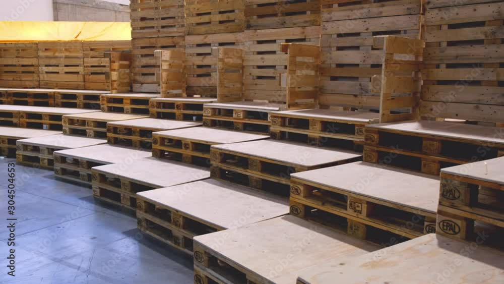 many empty pallets stored in warehouse many empty pallets stored in warehouse