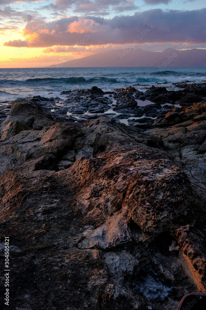 Volcanic Rocks at the Shore During Sunset