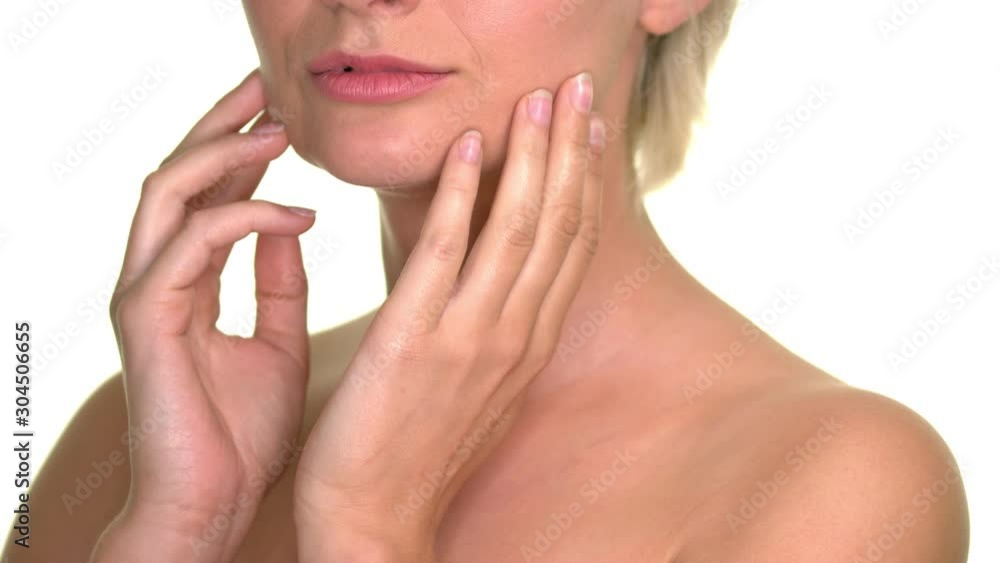 topless shorthaired lady smiling while touching her face, still close up shot topless shorthaired lady smiling while touching her face, still close up shot