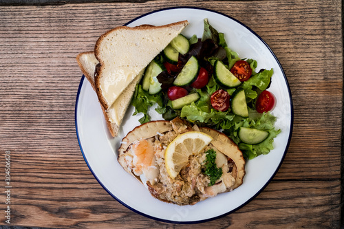 Directly above view of plate of dressed crab salad and toast photo