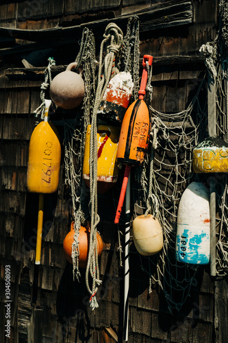 Colorful buoys tied to the side of old Fishing Shack
