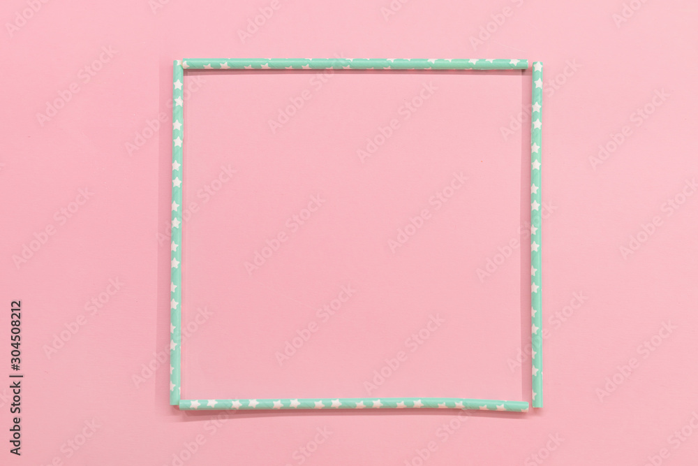 square frame with Colorful Paper coctail tubes on the pink background. Eco friendly. Zero Waste