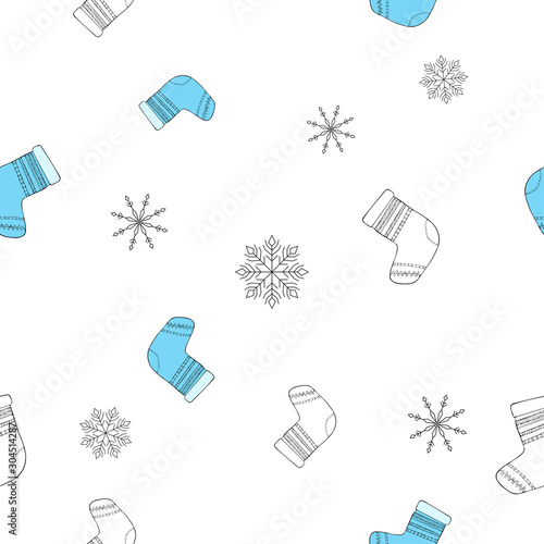 Bright blue sock with decor and geometric snowflakes on white background. Seamless winter pattern.