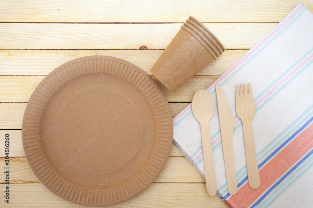 Eco paper plate fork on old wooden table