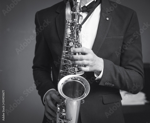 one caucasian man saxophonist playing saxophone player in studio silhouette isolated on white background