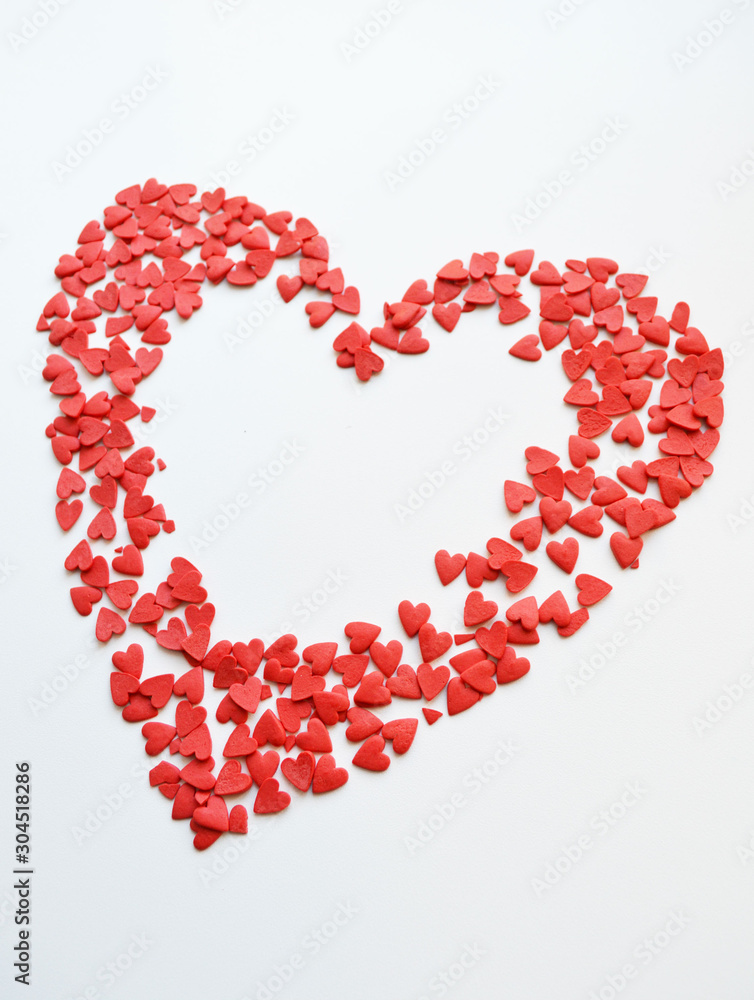 little red scattered hearts. a big heart for Valentine's day little red scattered hearts. a big heart for Valentine's day