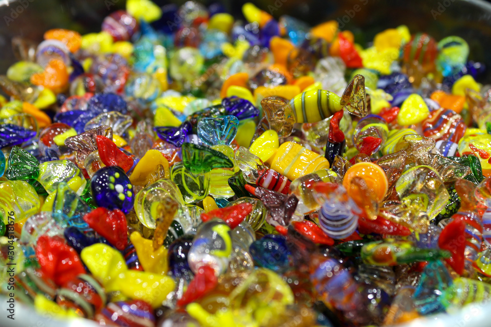 Closeup to venetian Murano colorful glass candies in Venice Italy