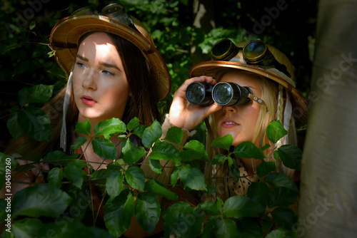 Obraz na plátně Two young girls dress up as explorers