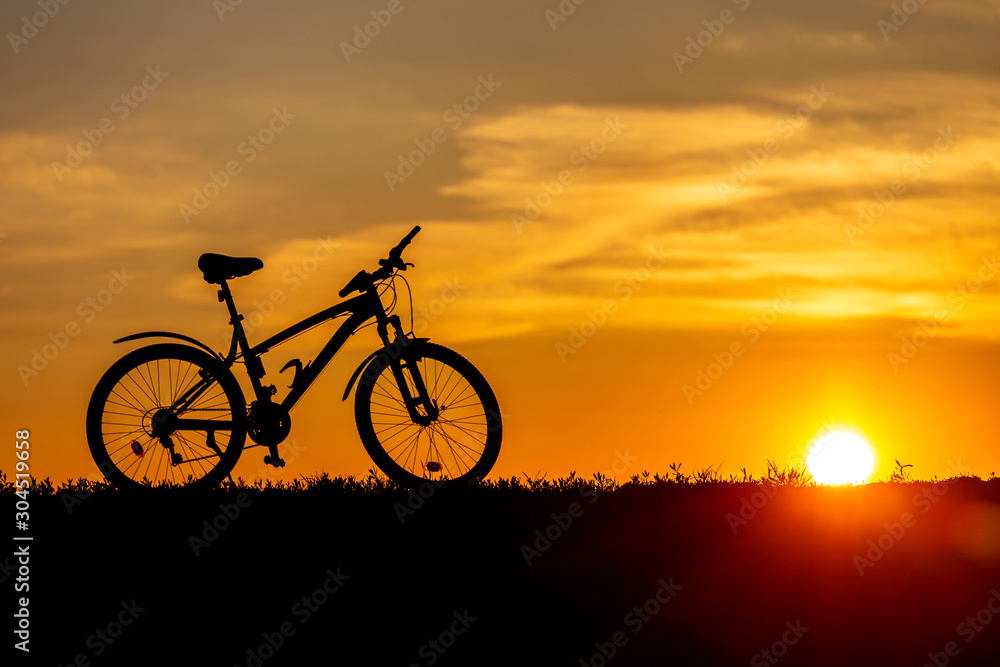 Mountain bike on the hillside at sunset. Mountain bike on the hillside at sunset.