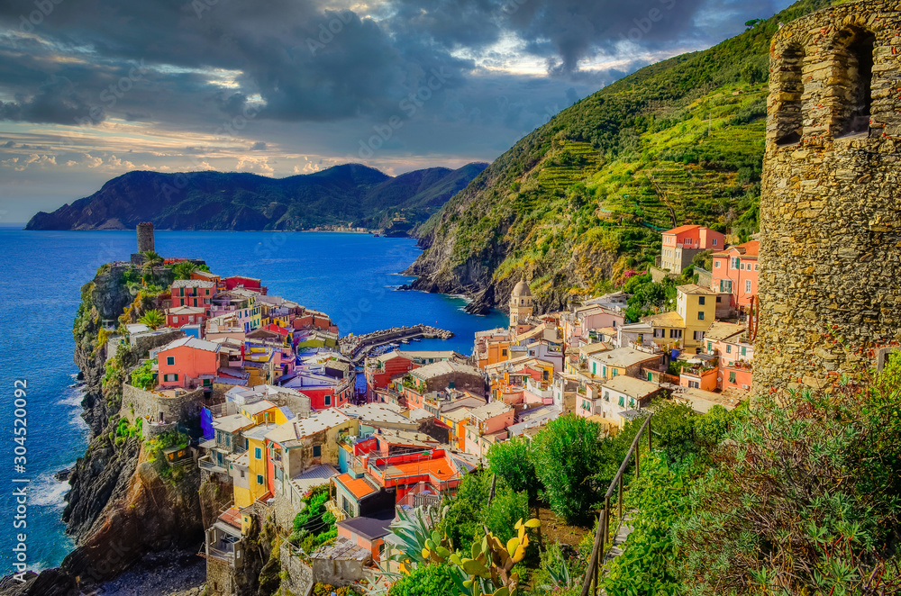 Landscape view of colorful village Vernazza with dramatic sky in Cinque Terre