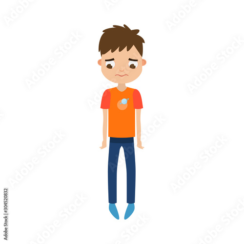 The cute brown-haired boy standing in blue pants with a sad face. Vector illustration in flat cartoon style.