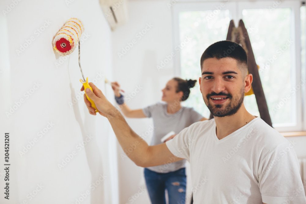 happy couple renovating their new flat happy couple renovating their new flat