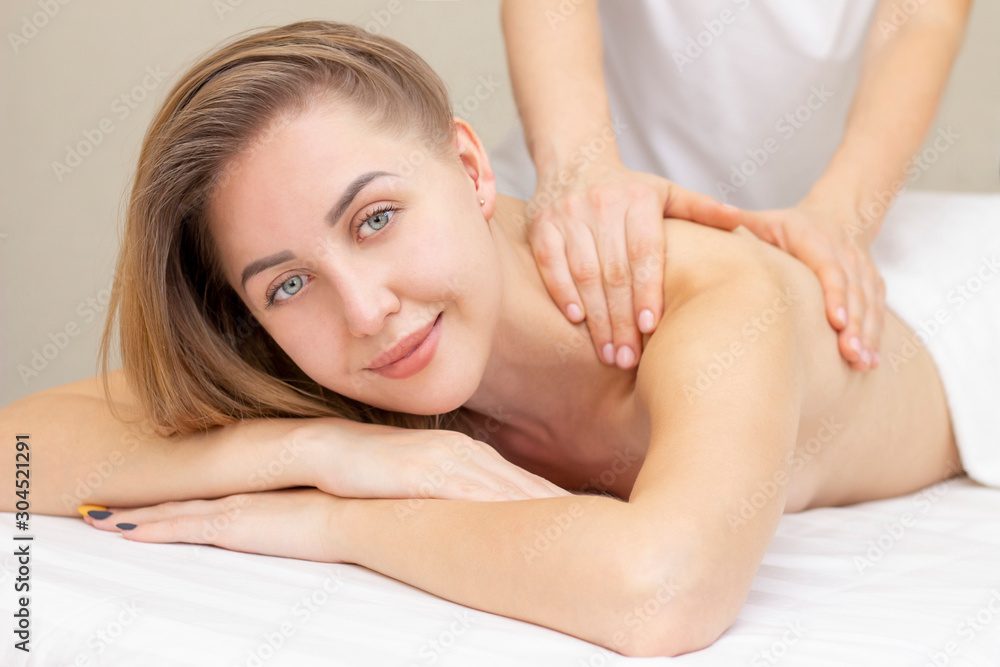 Massage and body care. Spa body massage woman hands treatment. Woman having massage in the spa salon for beautiful girl