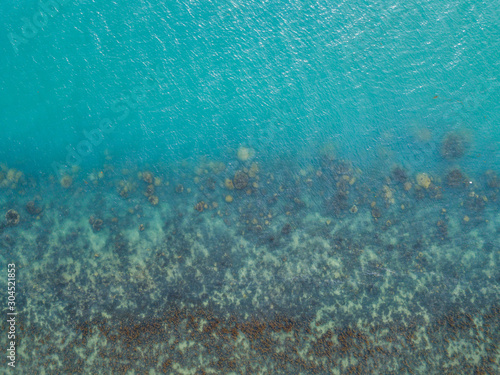 Stony bottom under greenish transparent water. Thailand 