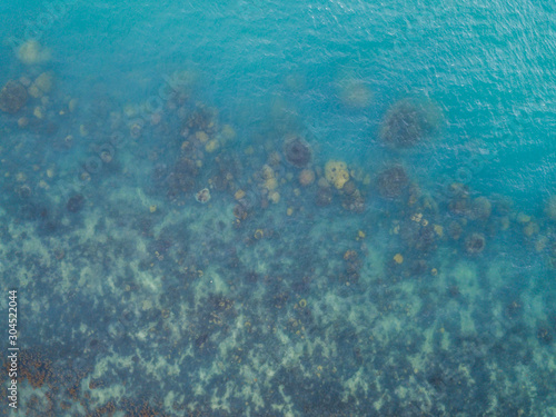 Stony bottom under greenish transparent water. Thailand 