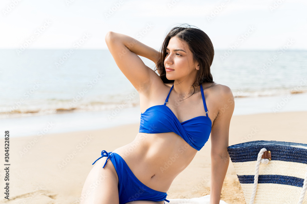 Woman Wearing Swimsuit While Resting At Beach Woman Wearing Swimsuit While Resting At Beach