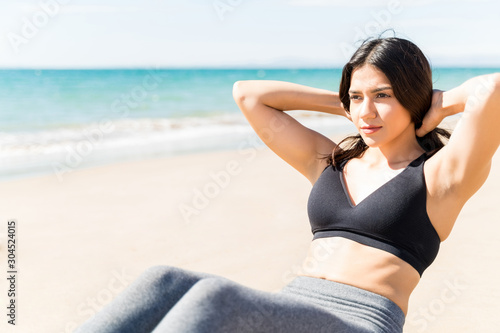 Beautiful Woman Exercising During Vacation