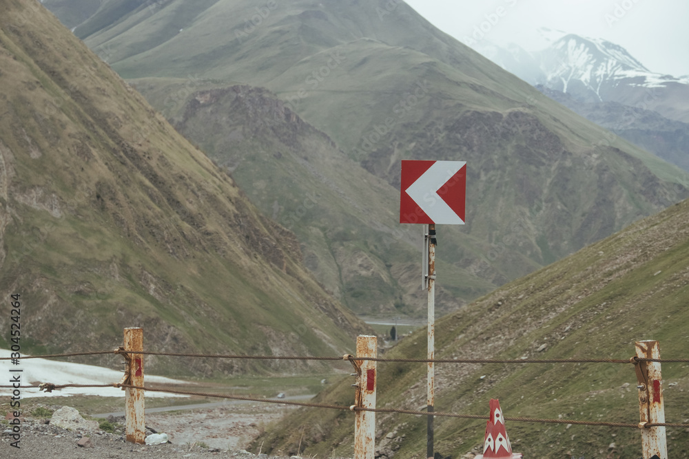 Road sign in Georgian mountains near Kazbegi Road sign in Georgian mountains near Kazbegi