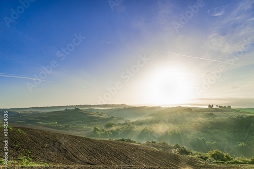 Beautiful foggy sunrise landscape in Tuscany  Italy