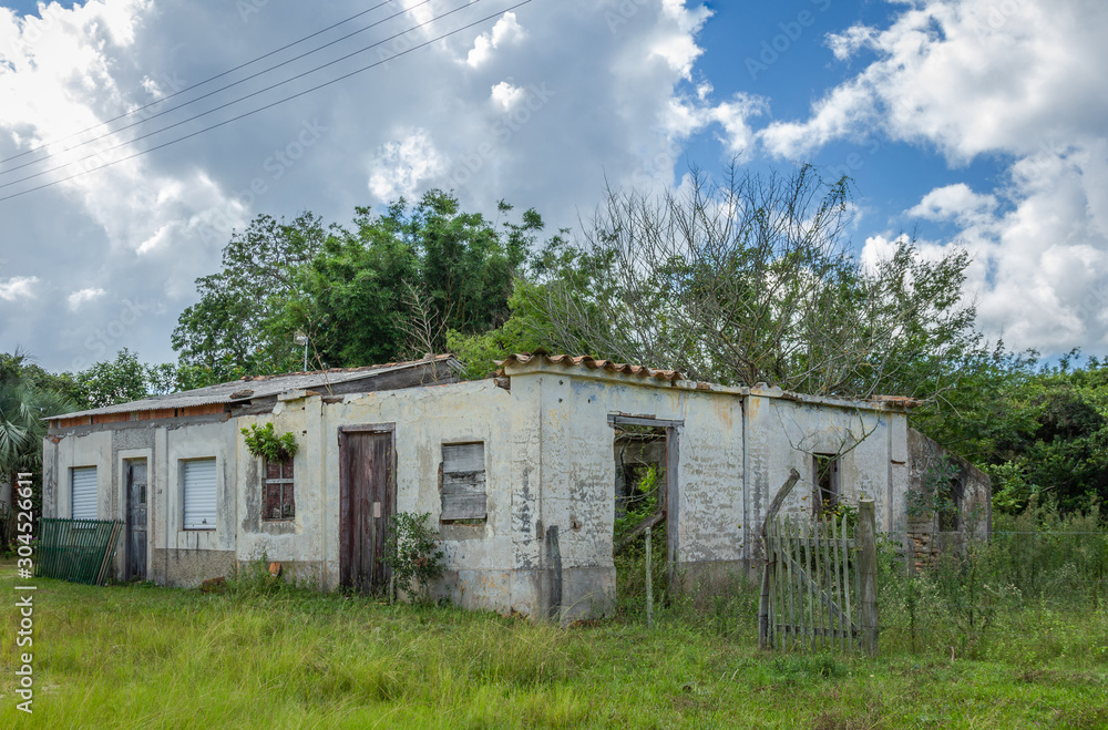 Exterior view of old abandoned villas with wooden doors and windows give the landscape a vintage look.
