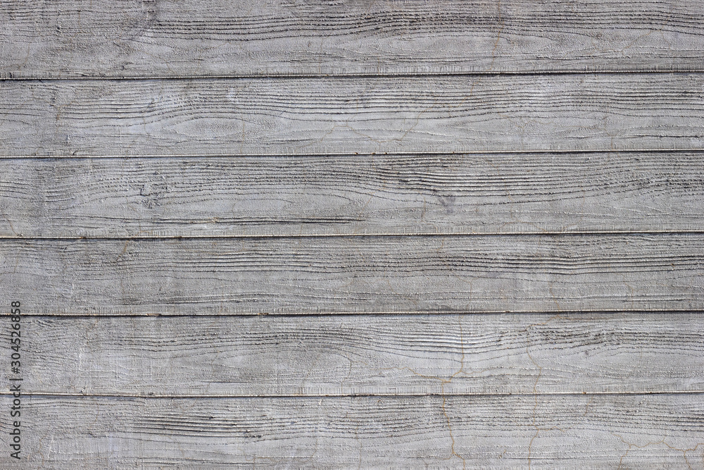 Gray concrete wall with traces of boards. Horizontal lines. Gray concrete wall with traces of boards. Horizontal lines.