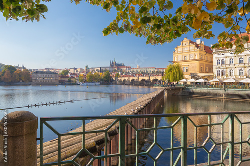 Prague-  The buildind of Bedrich Smetana museum and Charles Bridge, Castle and Cathedral in the background. photo